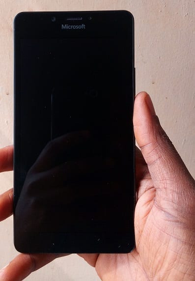 Holding the Microsoft Lumia 950