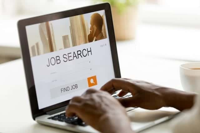 African-american man browsing work online using job search computer app Freelancing: A Potential Solution for Unemployment?