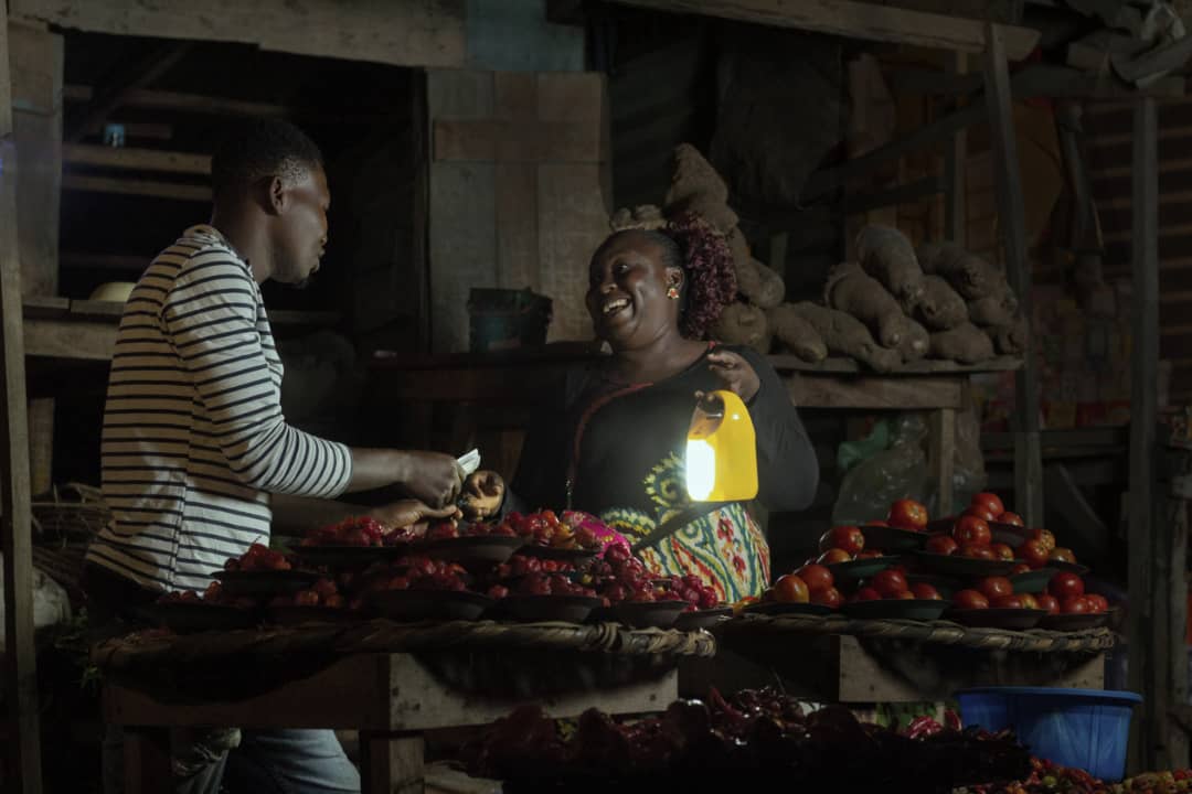 Market Woman / Trader using Salpha Bass Solar Home System