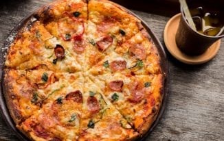 OFood Food Delivery Service offers Pizza among other Delicacies