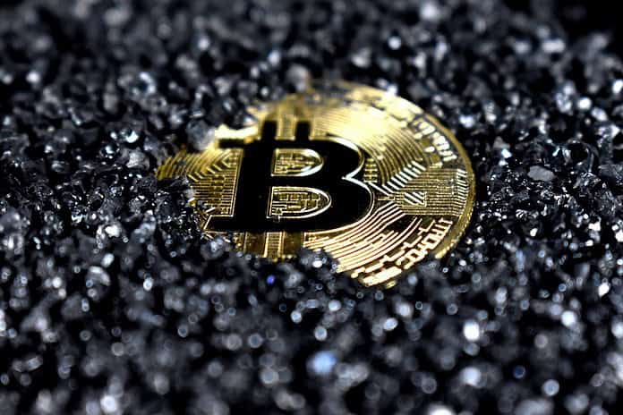 A Bitcoin covered in Black Crystals