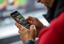 Man betting online on a sports app