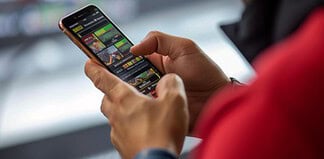 Man betting online on a sports app
