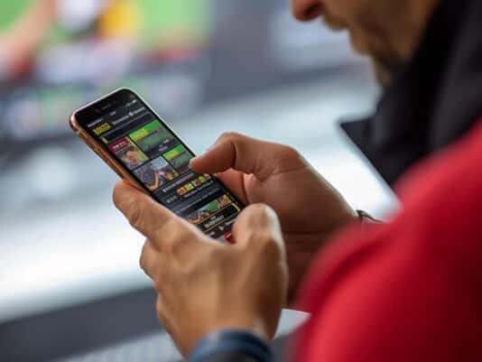 Man betting online on a sports app