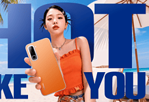 Infinix HOT 70 Series: How Infinix Is Using Design and AI to Differentiate in a Crowded Smartphone Market Model holding the Infinix Hot 70 phone on the beach