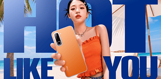 Infinix HOT 70 Series: How Infinix Is Using Design and AI to Differentiate in a Crowded Smartphone Market Model holding the Infinix Hot 70 phone on the beach