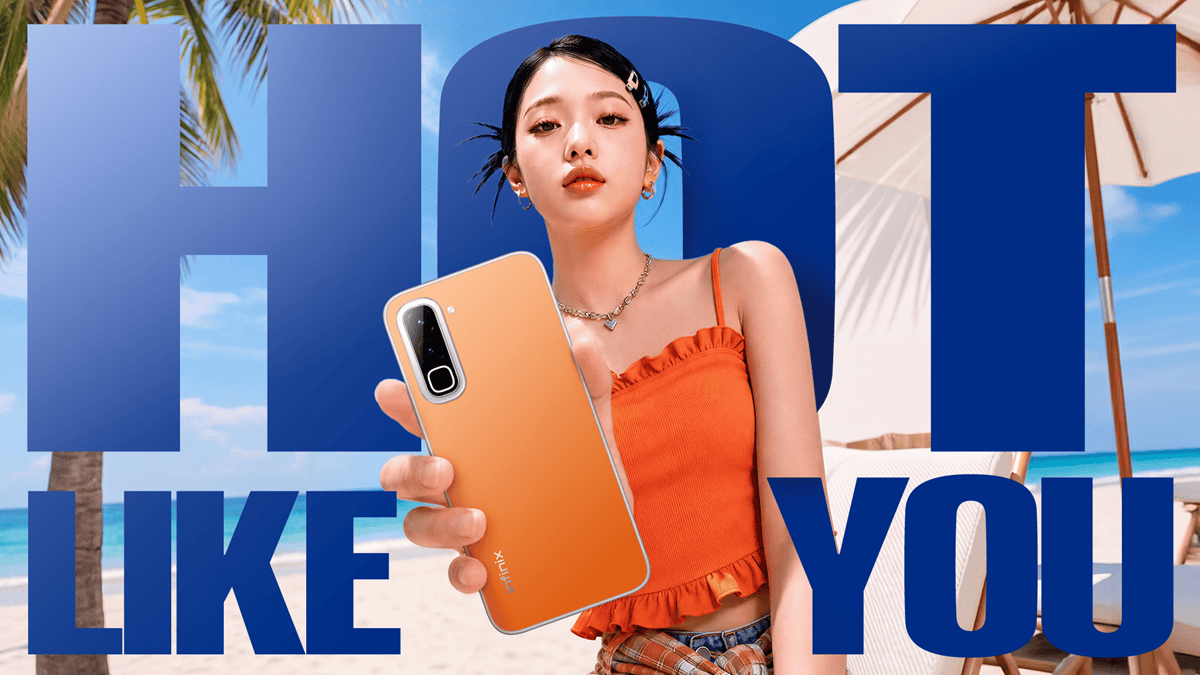 Model holding the Infinix Hot 70 phone on the beach