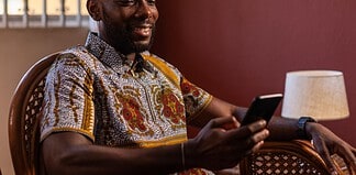 Adult smartphone user checking a mobile gaming platform