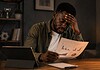 Five mistakes when reading sports statistics Man studies sports statistics on a printed report at a desk