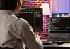 What Player Account Management Does for a Casino Specialist at a computer managing player accounts with an online casino provider